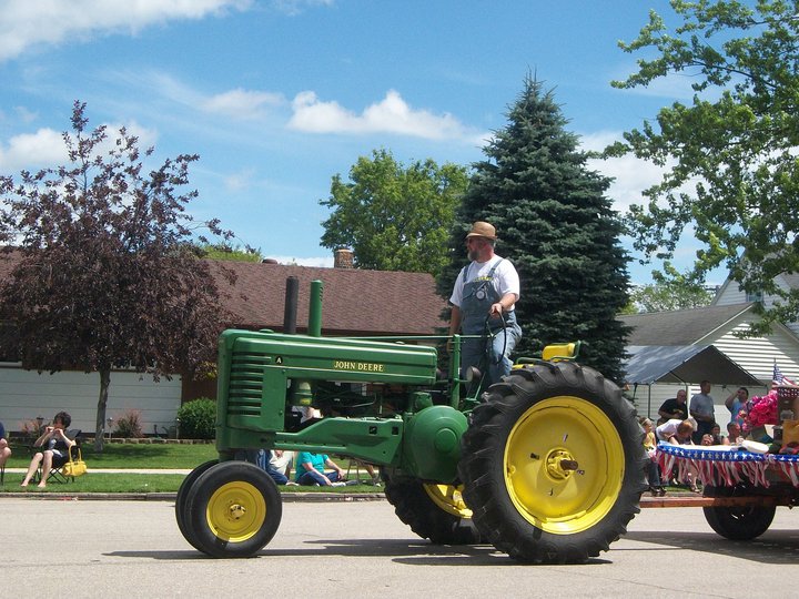 Arlan driving tractor in the Oklee parade