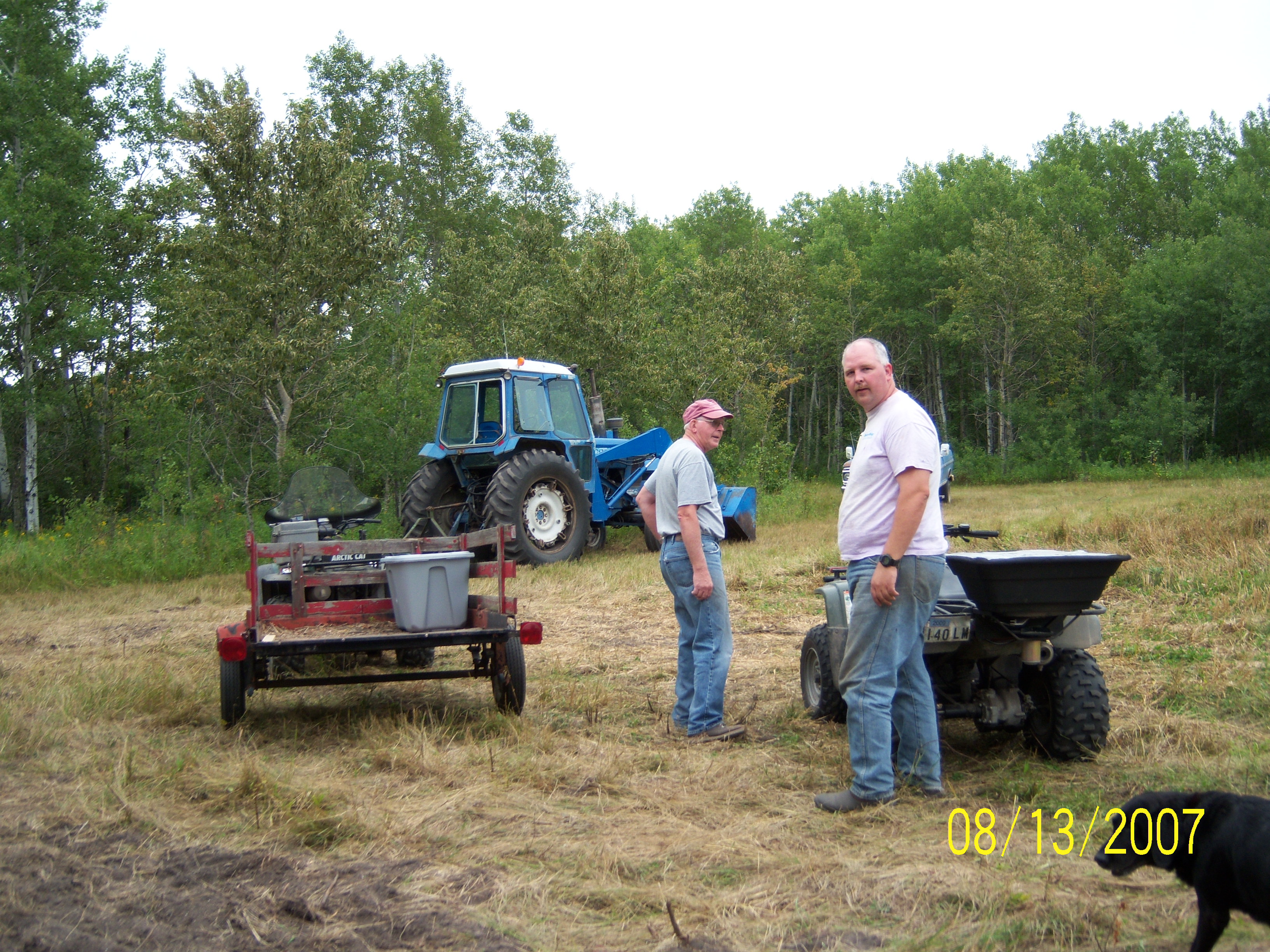 Glenn helping Arlan planting